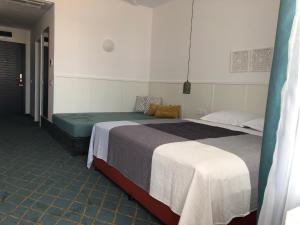 מיטה או מיטות בחדר ב-Sunrise Blue Magic Resort - All Inclusive