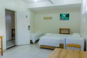 Katil atau katil-katil dalam bilik di Pousada Vila do Carmo
