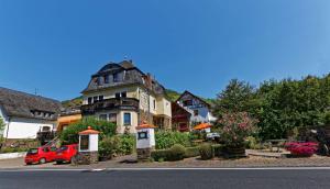 a large house on the side of a street at Ferienwohnung Moselblick in Ediger-Eller