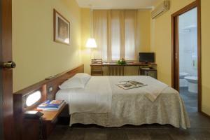 Postel nebo postele na pokoji v ubytování Hotel Mariani