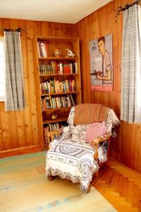 a bedroom with a bed and book shelves with books at Haus Poxleitner in Mauth