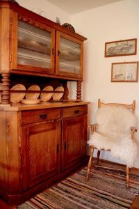 a room with a wooden cabinet with plates on it at Haus Poxleitner in Mauth