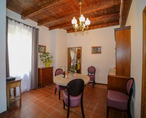 a dining room with a table and chairs at L'Escale in Bonifacio