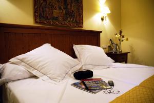 En eller flere senger på et rom på Hotel Casona de la Reyna