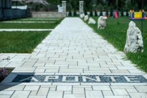 a walkway with a sign that says fun written on it at A Ponte Studios & Apartments in Sykia Chalkidikis