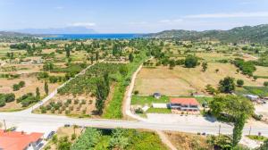 an aerial view of a road and a house at A Ponte Studios & Apartments in Sykia Chalkidikis