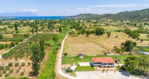 an aerial view of a house with a large yard at A Ponte Studios & Apartments in Sykia Chalkidikis