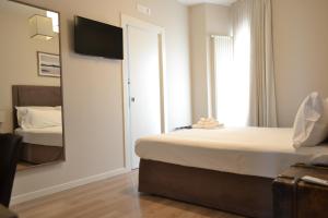 A bed or beds in a room at Gatto Bianco Le Terrazze