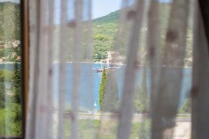 a view from a window of a boat in the water at Villa Nave in Zaton
