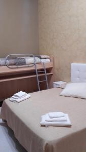 Postel nebo postele na pokoji v ubytování Vendicari