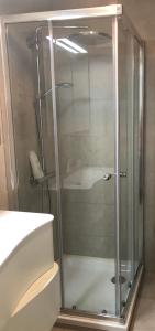 a shower with a glass door in a bathroom at Appartement Knokke-Heist in Knokke-Heist