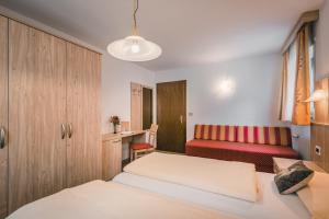 Letto o letti in una camera di Pension Merisana