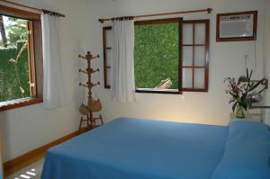 En eller flere senger på et rom på Casa do Canto