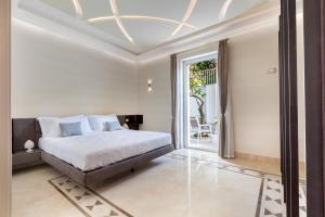 a bedroom with a bed and a large window at Sorrento Dream in Sorrento +71 photos