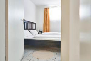Ein Bett oder Betten in einem Zimmer der Unterkunft Hotel Asslar