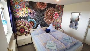 a bedroom with a bed with towels on it at Parklife Apartments in Winterberg