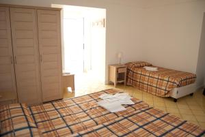 Postel nebo postele na pokoji v ubytování Villa Giusto