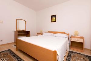 Posteľ alebo postele v izbe v ubytovaní Apartments Visnja