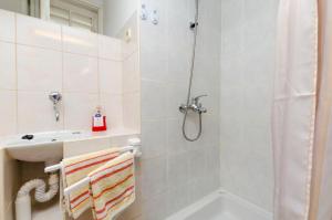 a bathroom with a shower and a sink at Apartments Visnja in Primošten