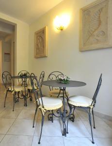 a group of tables and chairs in a room at Hotel Riviera Blu in Tirrenia