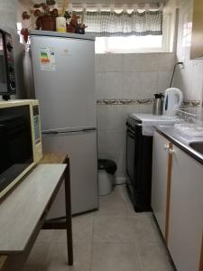 Kitchen o kitchenette sa Apart Hotel Aleman