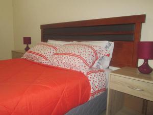 Giường trong phòng chung tại Casa TINY