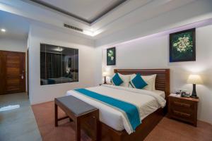 Voodi või voodid majutusasutuse The Tito Suite Residence toas
