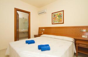 Łóżko lub łóżka w pokoju w obiekcie Sun Grove Villas & Spa