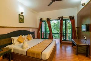 Katil atau katil-katil dalam bilik di Upavan Resort