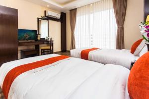 Postel nebo postele na pokoji v ubytování Bodhi Suites Boutique Hotel and Spa