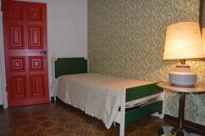 Postel nebo postele na pokoji v ubytování B&B VILLA LUPIDI
