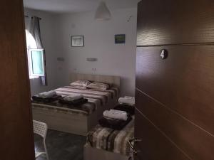 Postel nebo postele na pokoji v ubytování Apartmani Alex Beach