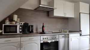 Kuchyň nebo kuchyňský kout v ubytování Ferienwohnung Utkiek