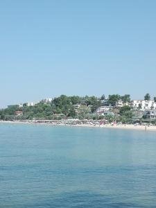 a view of a beach with a group of people at Blue Studio in Nea Moudania