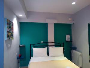 Posteľ alebo postele v izbe v ubytovaní Zappion Hotel
