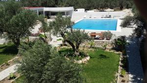 an aerial view of a villa with a swimming pool at Saint George Resort in Archangelos