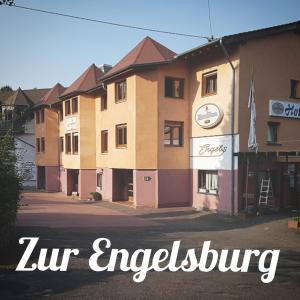 a building with the words zur ingelung in front of it at Hotel Zur Engelsburg in Hausen-Wied