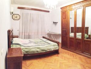 Кровать или кровати в номере Icheri Sheher Apartment