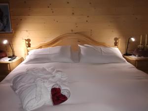 מיטה או מיטות בחדר ב-Baita del Nonno dei Pitoi