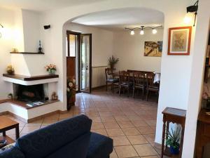 a living room with a couch and a fireplace at La Petite Maison - Panoramic Apartment in Vico Equense