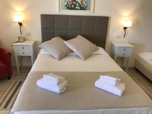 Postel nebo postele na pokoji v ubytování Relais Masseria Serritella