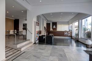 a lobby of a building with an archway at Hotel Caribe in Rota +57 photos