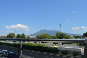 a view from the balcony of a parking lot at B&B Vesuvius in Naples