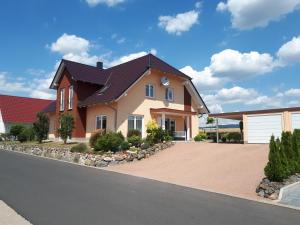 a large house with a driveway at Haus Fernblick in Breitungen