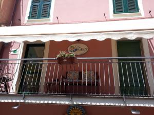 a balcony of a building with a plant on it at Ca' de Baran in Manarola