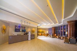 a lobby of a hotel with a reception desk at Arch Hotel in Manama