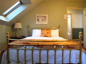 a bedroom with a bed in a attic at Brigantine Inn in Lunenburg