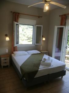 Krevet ili kreveti u jedinici u okviru objekta Rastoni Guest House Skopelos