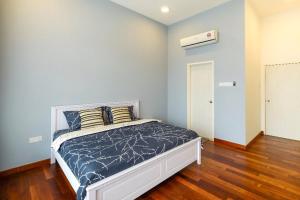 a bedroom with a bed in a room at By the sea Beach BABY in Batu Ferringhi +55 photos