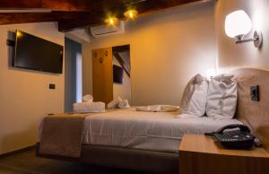 Postel nebo postele na pokoji v ubytování Hotel Pandora Residence